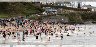 Swimmers brave the New Year chill for Cancer Research