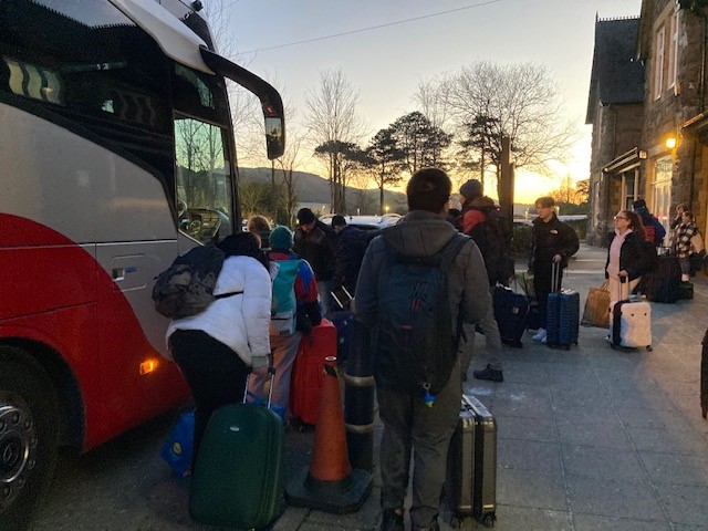 Passengers boarding a rail replacement bus service from Machynlleth station on 9 January