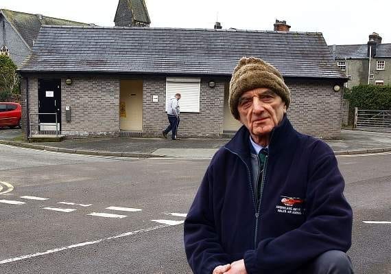 Cllr Michael Williams outside the public toilets