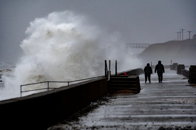 Two lonely souls walk the prom at Barmouth as storm Isha batters the seafront at 70 mph
Picture Erfyl Lloyd Davies PHotography 