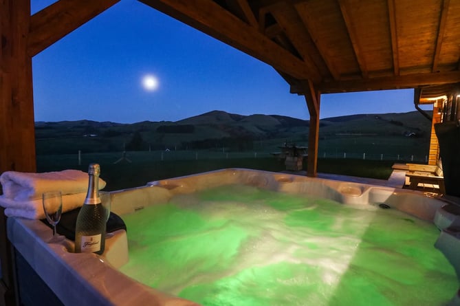 The log cabin has stunning views over the Powys hills