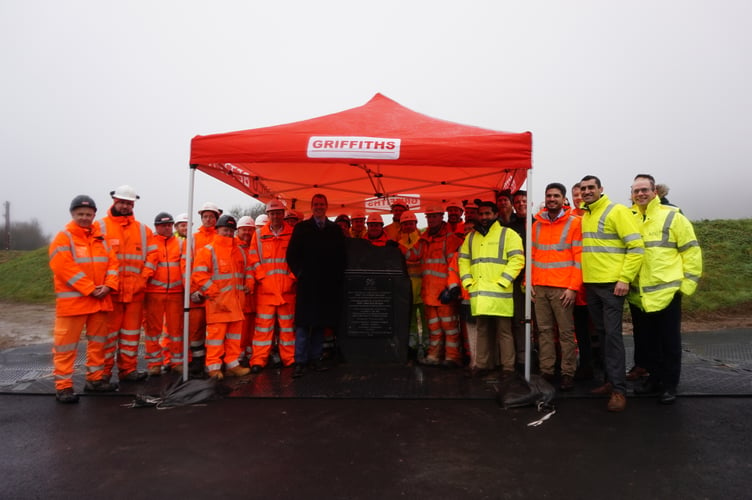 Deputy Minister Lee Waters with staff of Alun Griffiths Contractors at the plaque unveiling for the opening of the new Dyfi bridge