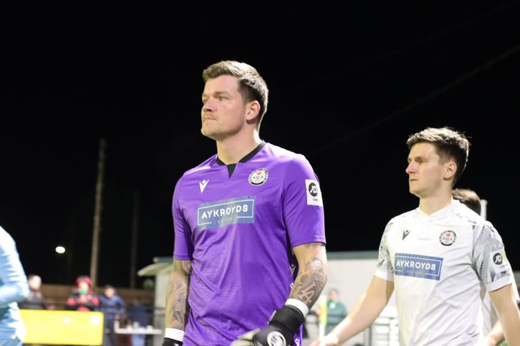 Keeper Kelland Absalom leads the Bala players out against TNS