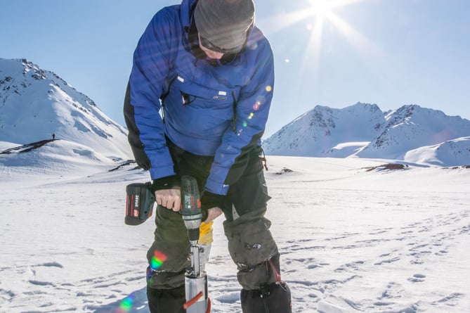 Dr Arwyn Edwards researching on Svalbard. 