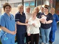 Church present baby unit with cheque to buy cot