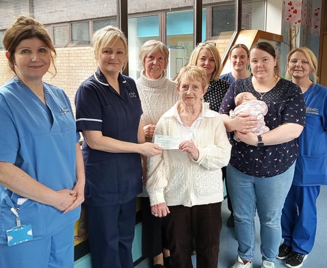 Church present baby unit with cheque to buy cot