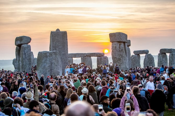 FILE PHOTO - Revelers celebrate the summer solstice at the historic site Stonehenge.  See SWNS story SWSMcomments. A tourist left a scathing review of Stonehenge saying it was "just a pile of rocks" - while another slammed Snowdon as "too steep" and would be "better in Cornwall". Unhappy customers have been taking to TripAdvisor to leave one-star reviews and voice their opinions over the UK's best loved tourist attractions. Stonehenge - a prehistoric monument on Salisbury Plain - attracts more than 800,000 visitors a year, but not all of them are fans. One review said: "It's a pile of rocks, and everyone on the A303 slows down to look at them. Pointless. Save yourself the time and don't go."