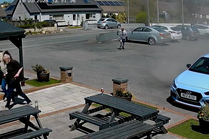 A brave pub-goer charges toward âmini tornadoâ to save his pint while other patrons flee from it's path at the Begelly Arms in Saundersfoot, West Wales, on May 19, 2024. Release date May 23 2024. This is the hilarious moment a man saved his pint from a 'mini tornado' in a pub beer garden. CCTV footage shows drinkers running away from the 'dust devil' which tore through The Begelly Arms car park. It hit the hotel and restaurant near Saundersfoot in Wales at around 1:50pm on Sunday (19 May) - leaving locals scattering. But one brave customer is seen rushing to the aid of an unattended pint left on a nearby table. Landlord, Peter Adams, said: "My wife and I were outside under the canopy talking to some customers we hadn't seen for a while.