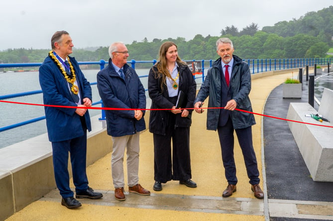 Welsh Government Cabinet Secretary for Climate Change and Rural Affairs, Huw Irranca-Davies cutting the ribbon on the new defences, with Cllr Beca Roberts, Chair of Cyngor Gwynedd; Cllr Medwyn Hughes, former Chair of Gwynedd Council; and Bangor City Mayor, Cllr Gareth Parry