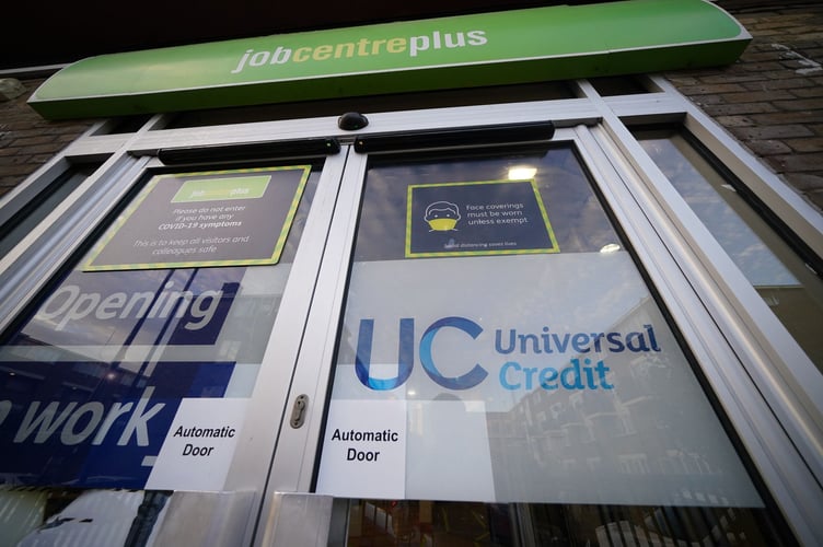 File photo dated 06/10/21 of a Universal Credit sign on the door of a job centre plus in east London. Any failure in the process of moving people to Universal Credit from older so-called legacy benefits could lead to "real-world misery for thousands", MPs have warned. The Department for Work and Pensions (DWP) must ensure it helps claimants, some of whom are "vulnerable", to switch and not lose their benefits, their report said. Issue date: Friday April 26, 2024.