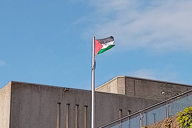 Protestors raised a Palestine flag above the university campus
