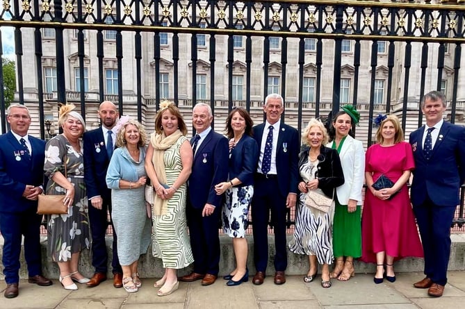 Group photo of RNLI volunteers and their families at Buckingham Palace. Photo: Pwllheli RNLI