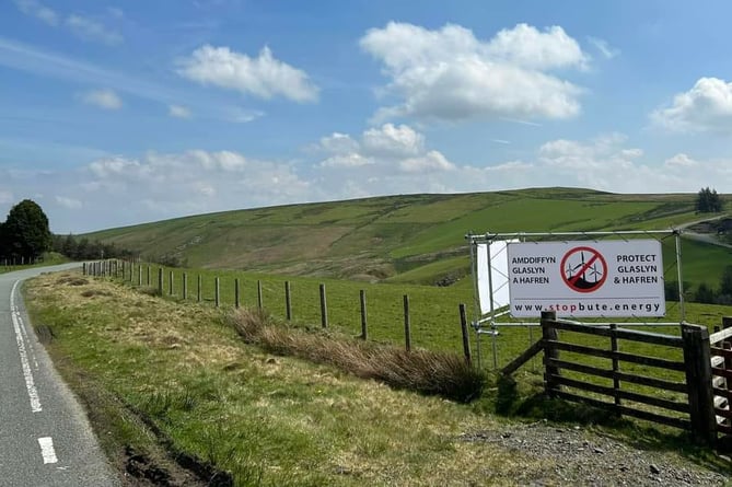 Fighting Esgair Wind Farm group erected banners on nearby roads