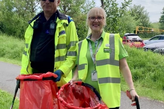 Pwllheli Asda community champion Jo Scott and PCSO Mark Holland pictured at one of their monthly community litter picks