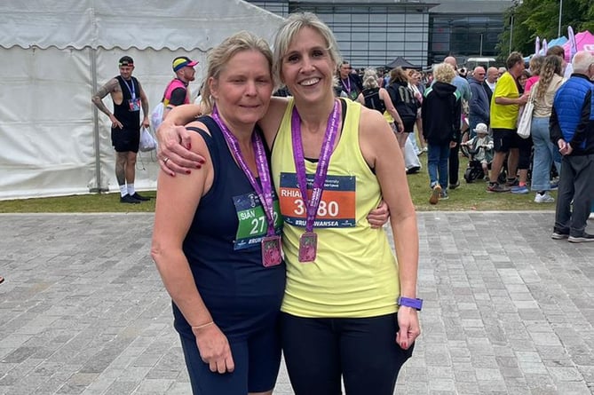 Sian and Rhian after completing their first half marathon at Swansea