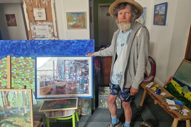 Cardigan artist Paul Hoare pictured with some of his work
