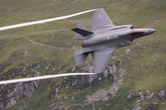 A US Air Force F-35A fighter jet, part of the 493rd 'Grim Reapers' Fighter Squadron that operate out of RAF Lakenheath.   Jaw-dropping images show military aircraft zooming through Wale's so-called Mach Loop on Monday (24 June). The pictures, snapped by Army photographer Dek Traylor, included two huge A400M transport planes from the Royal Air Force and a pair of US Air Force F-35A fighter jets. The American warplanes are of the 493rd 'Grim Reapers' Fighter Squadron that operate out of RAF Lakenheath. While the A400Ms are part of the Air Mobility Force based in RAF Brize Norton. The Mach Loop is a series of valleys in west-central Wales, notable for their use as low-level training areas for fast aircraft. The Loop is among the few places in the world where photographers can see combat aircraft flying below them.