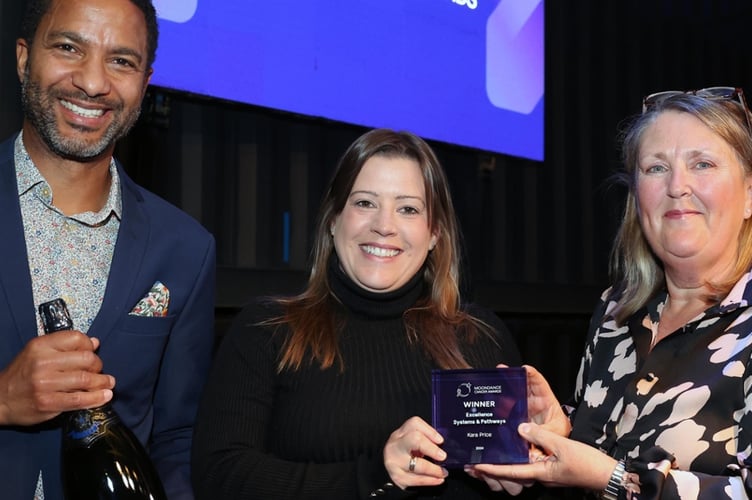 Kara (centre) is pictured with Sean Fletcher and Dr Heather Wilkes at the ceremony