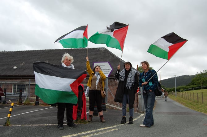 A group of Palestine supporters outside the gates to the Machynlleth hustings