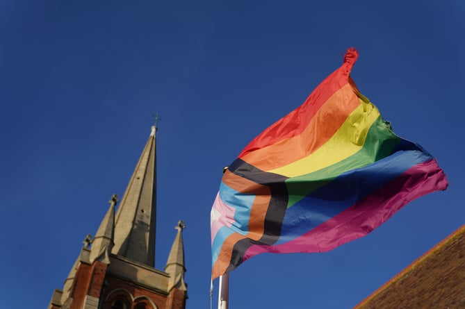 File photo dated 17/12/23 of a rainbow flag, a symbol of lesbian, gay, bisexual, transgender, and queer (LGBT) pride, flying at a church in Suffolk. Catholic bishops in England and Wales have issued new guidance stating that medical intervention for gender-questioning children should not be supported and social transitioning for the youngest should be avoided. Bishop of Northampton David Oakley insists that transgender people are welcome in the Catholic church. Issue date: Wednesday April 24, 2024.