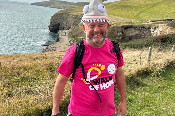 Andy Hampton on the Walk of Hope. A father dying of brain cancer is climbing Snowdon to defy the odds and help prevent future generations from suffering from the disease. Andy Hampton, 54, was diagnosed with a deadly glioblastoma (GBM) brain tumour 14 months ago. Despite the immense challenges, the father-of-four from Dorset will be scaling Yr Wyddfa, a 1,085 metre (3,560 feet) peak in Wales, on Saturday 6 July. Andy will be raising money and awareness for Brain Tumour Research - and his four-year-old daughter Isabelle will be right by his side on the climb. 