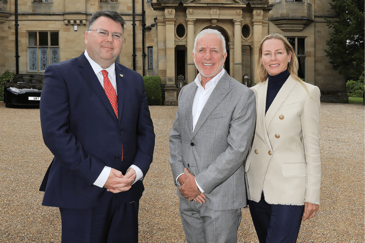 Owners Anthony and Donna Cooper-Barney with director Calum Milne (left) outside the impressive Palé Hall