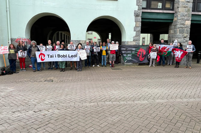 Cymdeithas yr Iaith members outside Gwynedd Council's building in Caernarfon earlier today