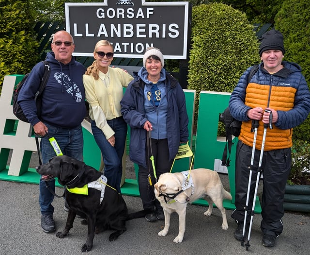 Llŷn guide dog owners hike up mountain to raise thousands for charity