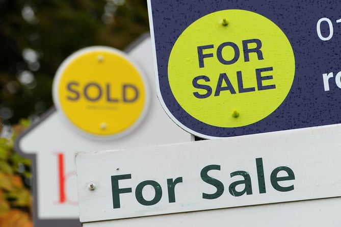 General view of estate agents signs outside a block of flats in Basingstoke, Hampshire.