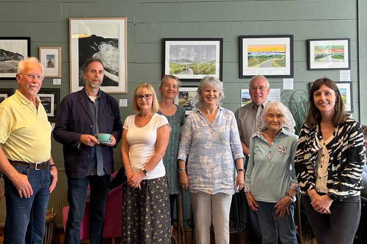 Some of the artists are pictured at the café where their work is on display