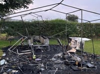 Fire destroys trailer tent but five people and dog survive