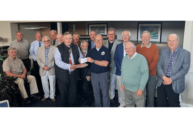 Aberystwyth Rotary Club President, Phil Evans, presents a cheque for £2,000 to Mathew Leeman from Blood Bikes Wales Aberystwyth