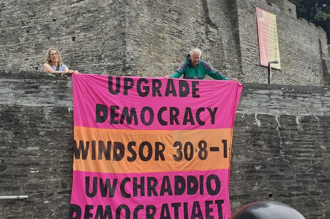 The group's banner at Cardigan Castle