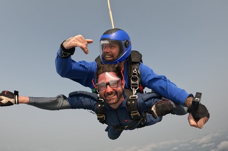 Alex Neil took part in a tandem skydive in Swansea