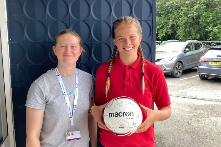 Amy Jenkins, Youth Worker with Ceredigion County Council presenting an award to the winner of the competition, Katie Whiteway.