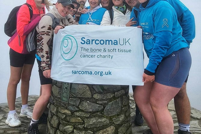 The group that climbed Snowdon. August 17 2024.  Photo released August 22 2024. A girl was diagnosed with a rare tumour on her foot - after doctors mistook it for a wart.Nansi Alys was taken to the doctor at the age of three after her mum Leila Evans noticed a small lump on Nansi's toe.Doctors told Leila that the lump was a wart - but in the months following, the lump continued to grow.Leila, from Criccieth in Gwynedd, Wales, persisted - until in 2022, when a different GP saw the lump and believed it to be a tumour.
