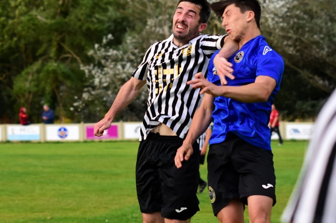 An aerial challenge during the goalless draw between Penparcau and Bow Street Reserves at Min y Ddol on Friday evening 