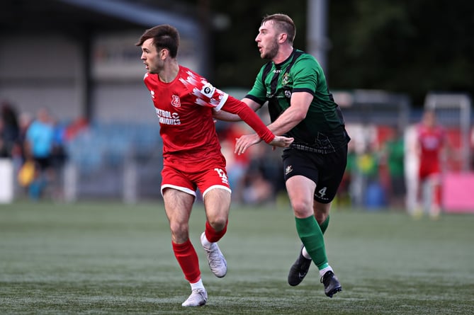 NEWTOWN, POWYS, WALES - 26th AUGUST 2023 - Newtown's Devon Torry and Aberystwyth's Louis Bradford during Newtown AFC vs Aberystwyth Town in Round 3 of the JD Cymru Premier at Latham Park, Newtown (Pic by Sam Eaden/FAW)