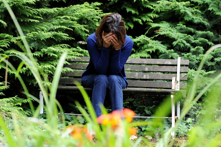 PICTURE POSED BY A MODEL. File photo dated 31/07/14 of a woman showing signs of depression. Violence and abuse towards women and girls is driving up cases of mental illness, leading medics have warned. The Royal College of Psychiatrists said that a significant number of patients are coming forward for help with mental health issues after being subject to abuse. Long-term abuse can lead to suicidal thoughts or symptoms of psychosis, the college said. Issue date: Friday March 8, 2024.