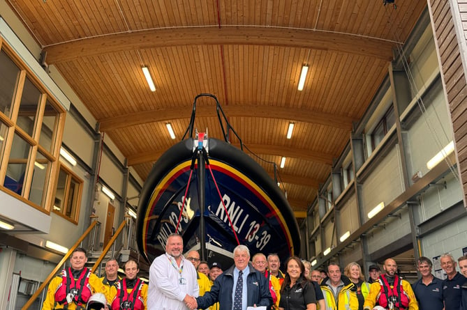 Haven Porthmadog donate money from a charity football match to Pwllheli RNLI. Photo: RNLI/Caroline Jones