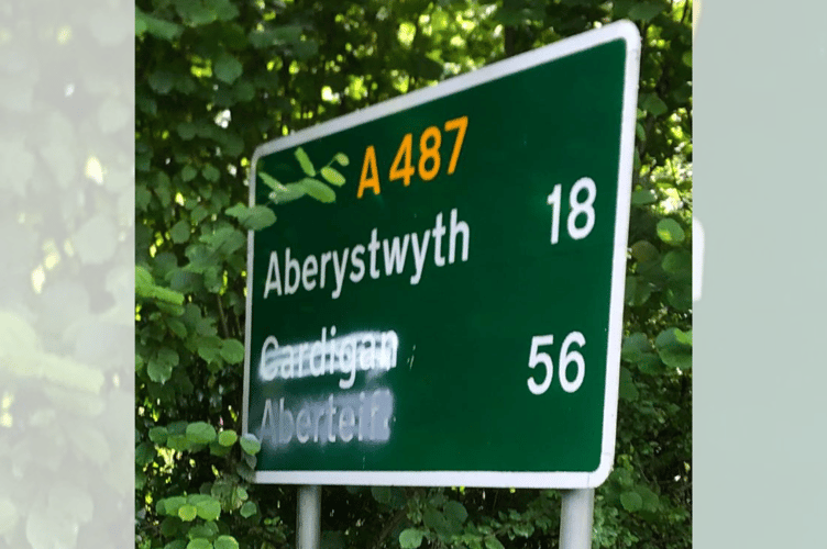 The sign showing both 'Cardigan' and 'Aberteifi' crossed out