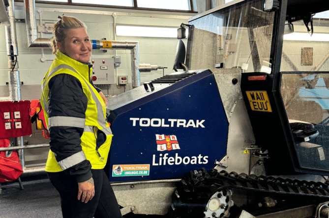 Photo of Lindsay Rees with Pwllheli RNLI Tooltrack launch vehicle. Photo: RNLI/Caroline Jones 