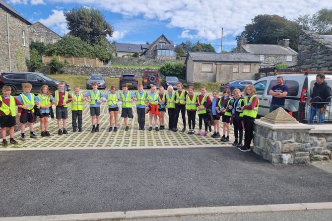 Instead of cutting a ribbon local school children lined up, linking arms, before stepping back to open the car park