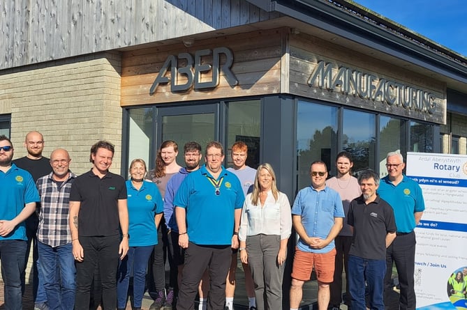 Emma Thomas and President Martin Tranter (centre) with ABER staff and Ardal Aberystwyth Rotarians