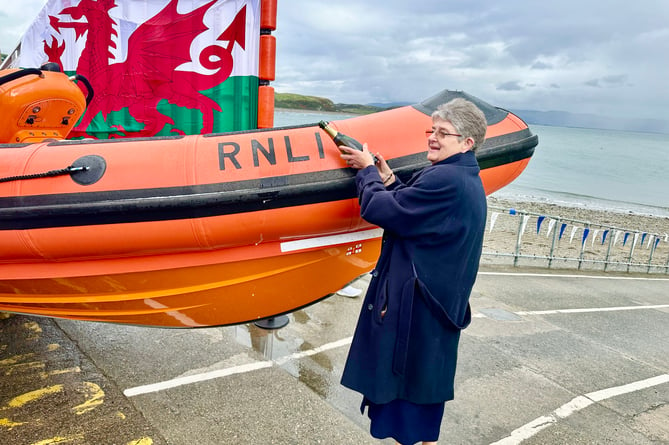 On behalf of the family, Barbara Dickinson officially named the boat