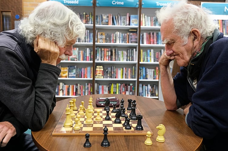 Porthmadog Chess Club members John Bowers (left) and Mike Leaver (right) in Porthmadog library. Photo: Terry Mills