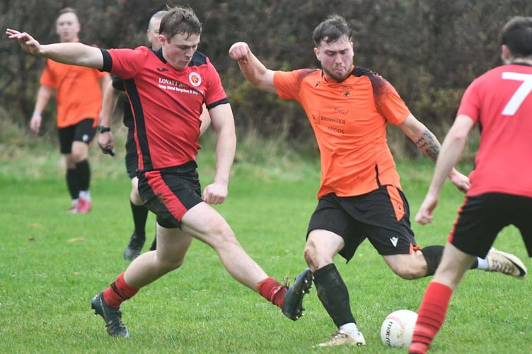 Tywyn's Aled Jones is pressurised in possession (Photo: Doris O'Keefe)