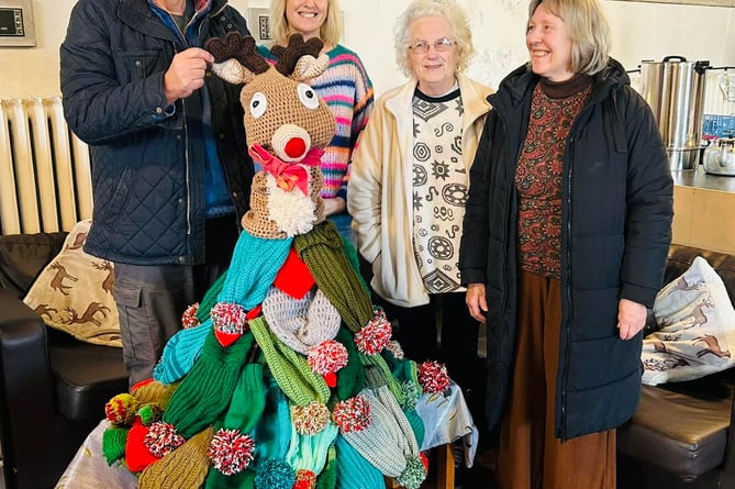 Creative Criccieth made multi-coloured crocheted and knitted Christmas trees for two shop windows, and donated a new Christmas tree made of woolly bobble hats to Pwllheli food bank, along with knitted and crochet blankets