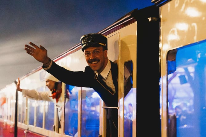 The train conductor, carriage chefs and staff greet you as the train arrives. Photo: Polar Express Aberystwyth