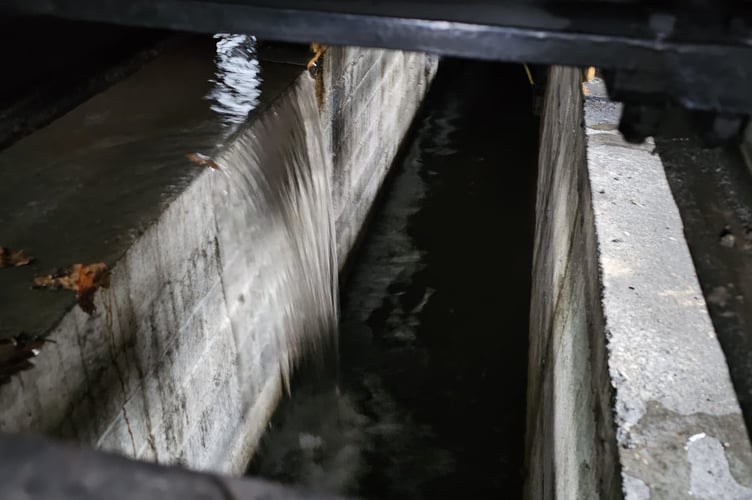 Rain water flooded off the road and cascaded into the machine shop, engine shed and loco inspection pit